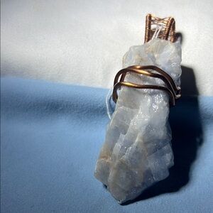 Elegant White Crystal Pendant with Copper Wire Wrap